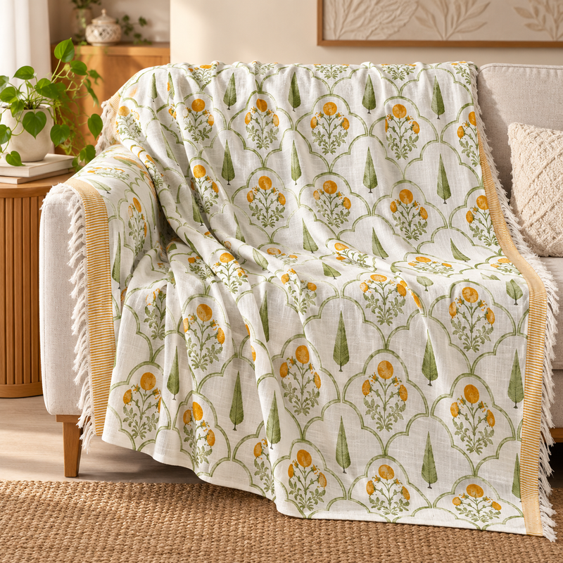 Green Bloom Sofa Throw draped over a sofa