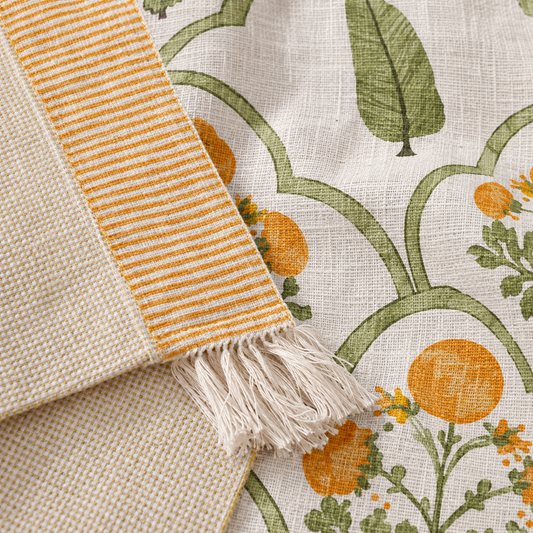 Close-up of the print and fringed edge on the Green Bloom Sofa Throw