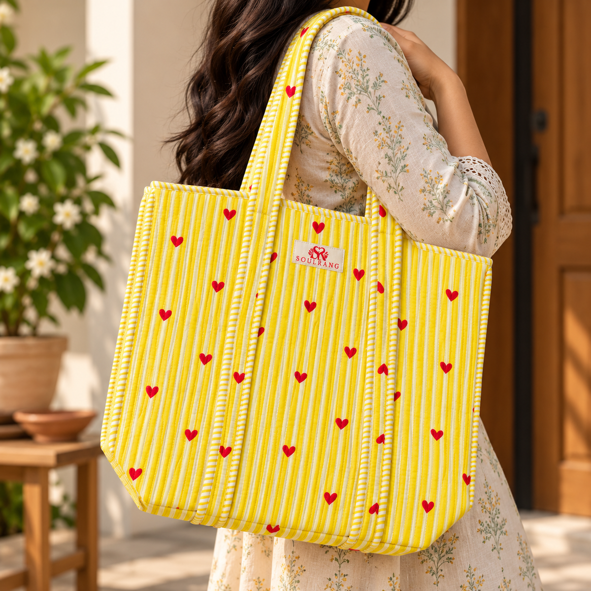 Happy Hearts Tote Bag carried on the shoulder