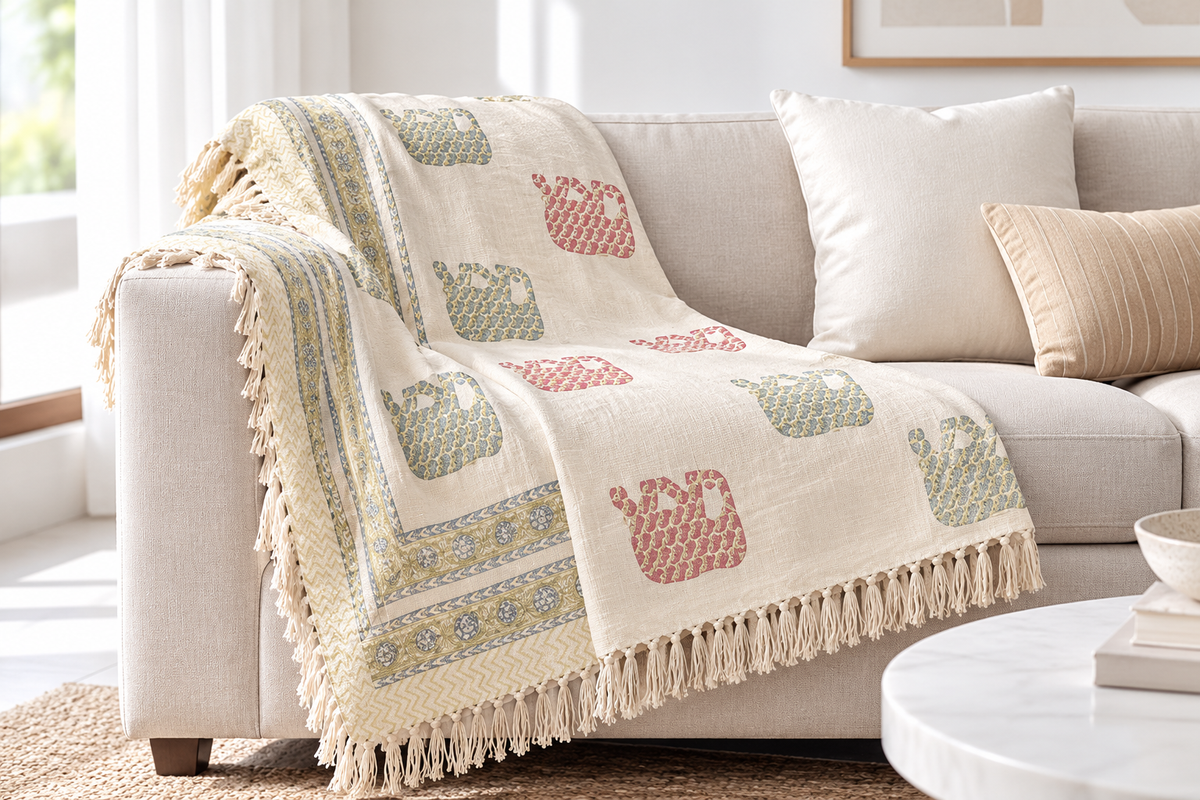 Rangoli Sofa Throw draped over a sofa
