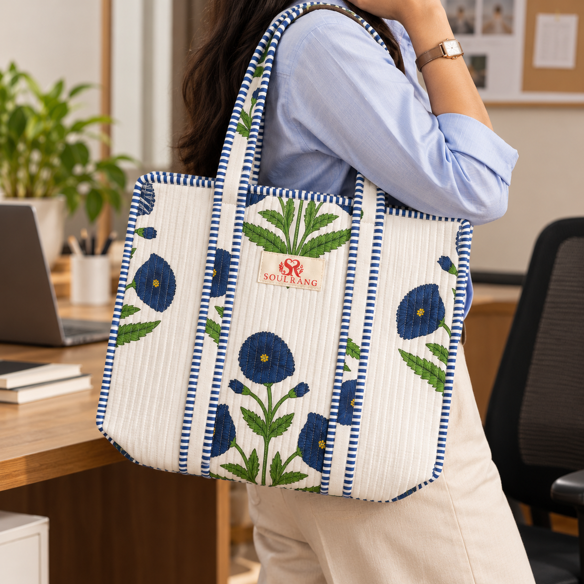The Indigo Bloom Tote Bag carried on the shoulder