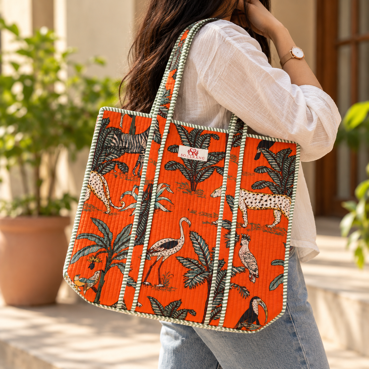 The Jungle Edit Tote Bag carried on the shoulder