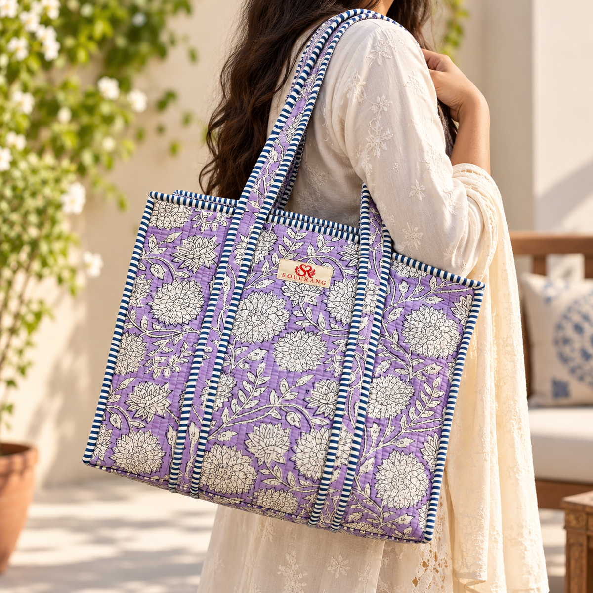 The Lavender Bloom Tote Bag carried on the shoulder